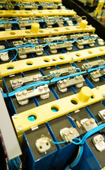Fototapeta premium Electric vehicle battery for truck and , Lithium Iron Phosphate Batterys, EV technologies. Manufacturing of EV Lithium Battery pack. Lithium car battery on Production Line, Conveyor. Electric Car.