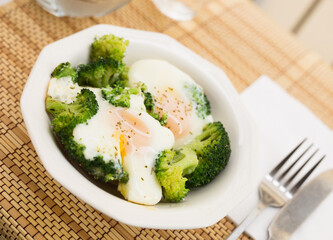 breakfast of crumpled eggs with broccoli