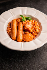 Cassoulet beans with meat and sausage french cuisine vegetables dish natural product tasty snack fresh delicious gourmet food background on the table rustic top view copy space