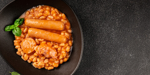 Cassoulet beans with meat and sausage french cuisine vegetables dish natural product tasty snack fresh delicious gourmet food background on the table rustic top view copy space