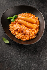 Cassoulet beans with meat and sausage french cuisine vegetables dish natural product tasty snack fresh delicious gourmet food background on the table rustic top view copy space