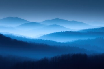 Obraz premium Misty Mountain Range: A serene landscape of layered mountain silhouettes bathed in the cool hues of blue, with a soft and ethereal haze. Evoking tranquility and the immensity of nature.