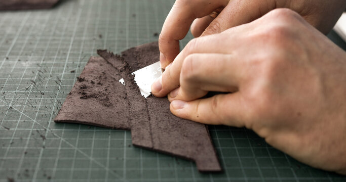 Shaving and skiving leather piece with blade for handmade leathercraft process