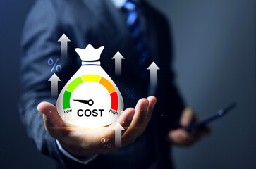 Cost reduction concept with businessman holding money bag and cost indication to low represented decrease of manufacture factor and increase profit for industry factory or business lean