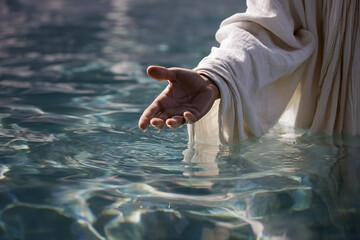 Submerged offering gesture in reflective waters symbolizing divine presence