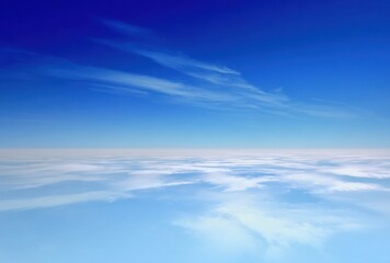 Azure sky fading from vibrant blue above to airy white clouds lining a hazy horizon, evoking a sense of infinite space and tranquility
