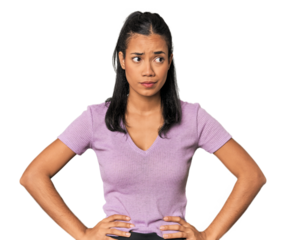 Young Filipina woman confused, feels doubtful and unsure.