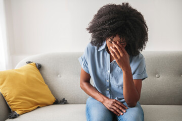 Black woman feeling regret emotion, depressed person.