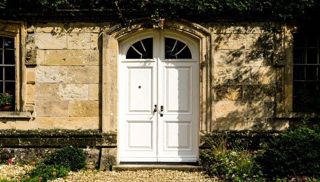 Old stone building with white door