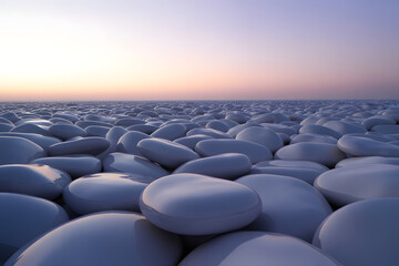 Obraz premium A serene, minimalist landscape of smooth white pebbles stretching towards a soft pastel sunset horizon.
