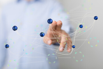 Image of a hand interacting with a digital network, representing global connections and technology.