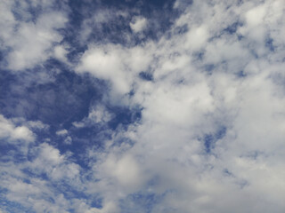 Cloudy Sky with Fluffy White Clouds and Blue Patches.