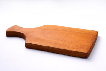 A simple, light brown wooden cutting board with a handle, isolated on a clean, white background. The smooth surface of the board is prominent