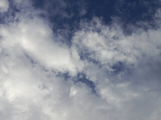 Dramatic Sky with Wispy Clouds and Dark Blue Hues.