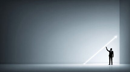 Obraz premium A silhouette of a person gesturing towards a bright white diagonal arrow against a dark background,