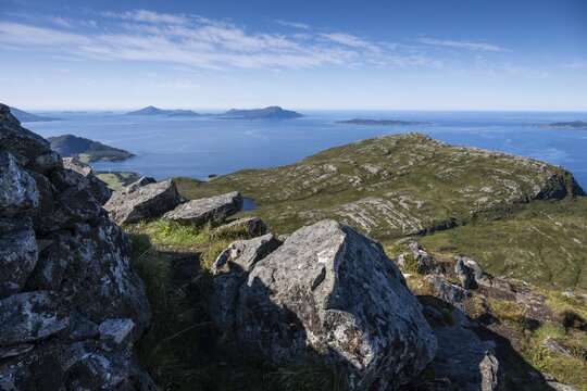 View over rocky mountain and coastal landscape, offshore islands in the background, Otroya or Otr&oslash;ya, M&oslash;re og Romsdal, Norway