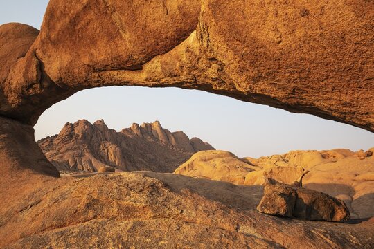 The Pondok mountains seen through The Bridge belong to the Spitzkoppe mountain compound. Damaraland, Namibia