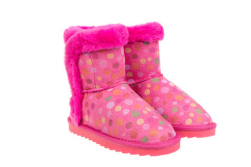 Adorable pair of pink polka dot winter boots for girls with cozy faux fur trim. Fun and warm children's footwear for cold weather, isolated on a white background.