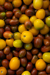 Top view of harvest tomatoes yellow and brown food in crate