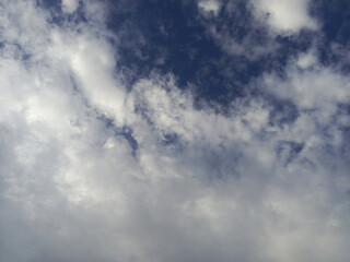 White Clouds Against Deep Blue Sky - A Serene Landscape.