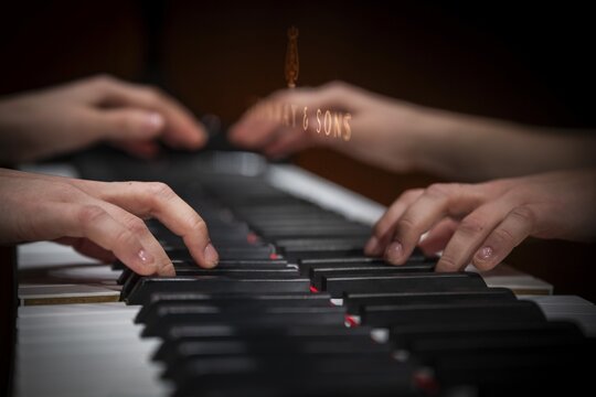 Hands of a young pianist playing on the keyboard of a Steinway & Sons grand piano, Stuttgart, Baden-W&uuml;rttemberg