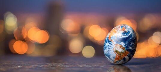 Earth-painted egg stands against a soft bokeh backdrop of city lights. A smooth surface reflects the lights and egg's texture, creating depth