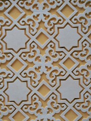 Ethnic decorative ornaments in silver and orange.