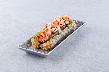 Japanese sushi roll with shrimp, avocado, cream cheese and unagi sauce