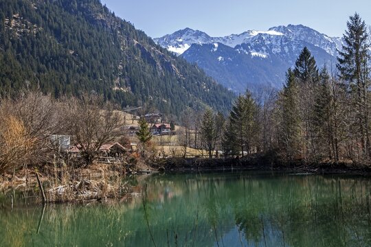 Small lake near Hinterstein, behind mountains of the Allg&auml;u Alps, Bad Hindelang, Oberallg&auml;u, Allg&auml;u, Bavaria, Germany