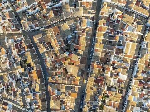 Streets and rooftops in the White Town of Olvera. Aerial view. Drone shot. C&aacute;diz province, Andalusia, Spain