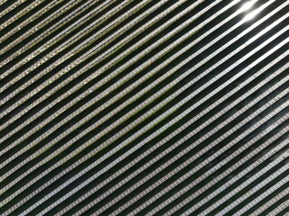 Rows of solar panels at a photovoltaic plant near the town of Espejo. Aerial view. Drone shot. Córdoba province, Andalucía, Spain