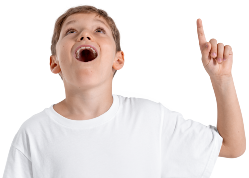 Young excited boy in white shirt pointing up with mouth open, realistic style, isolated on white background. Concept of surprise, discovery or idea - Powered by Adobe
