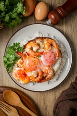 Homemade Rice topped with fried eggs and shrimps