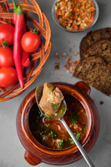 Traditional soup with tomatoes and red chili peppers