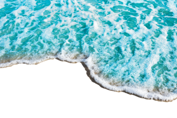 Gentle ocean wave with frothy white foam approaches shore, creating serene and calming scene