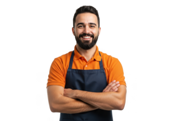 Confident bearded man with dark hair wearing an orange shirt and black apron with arms crossed smiling transparent background