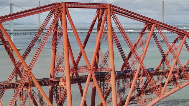 Trains on Forth Bridge from a drone, Queensferry Crossing, Forth Estuary, Scotland