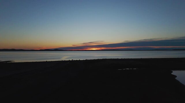 Drone footage of the mudflats on the coast of St. Andrews town in New Brunswick, Canada at sunset