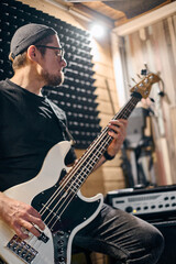 Obraz premium Bassist in action during music band rehearsal