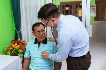 Fototapeta premium A doctor meticulously checks a patients heartbeat during a thorough consultation examination