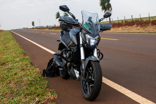 Mato Grosso do Sul, Brazil - September 14, 2022 - Black Bajaj Dominar 400 motorcycle on the road in the city of Laguna Carap&atilde;