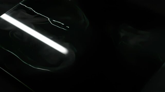 Obsidian Mirror With Diagonal Light Streaks
