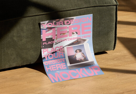 Mockup of blank poster leaning against a couch