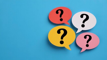 Four colorful speech bubbles with question marks on a blue background