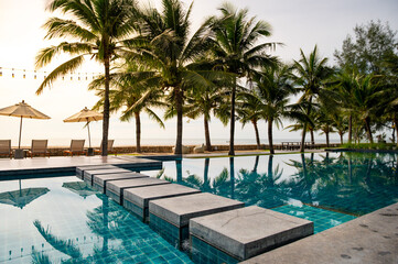 Relaxing poolside retreat at luxury resort tropical paradise photography sunset vibes serene environment