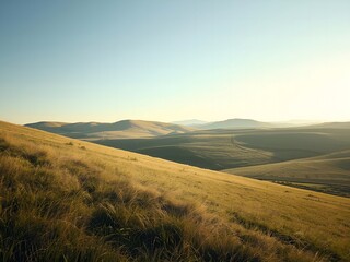Tranquil golden grasslands and rolling hills landscape at sunrise create peace