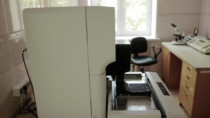 Modern medical equipment automatic analyzer of physical and chemical properties of urine in the laboratory. Medical laboratory