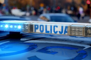 Polish police car in Krakow, Poland. Police car roof lights blinking. © Tupungato