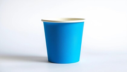 A single, disposable blue paper cup sits on a white background, background, clean