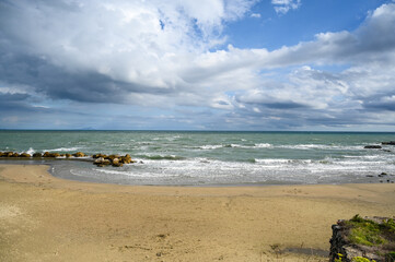 Tyrrhenian Sea in Anzio, Italy. Waves on the sea. Cloudy weather. 